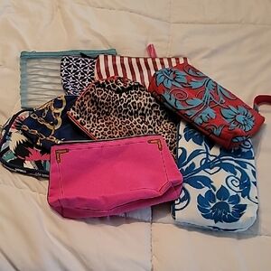 7-  Estee Lauder Cosmetic Pouches in Pink, Blue, Red, Leopard & Floral Prints